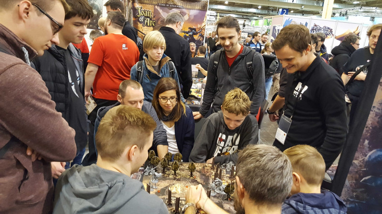 Folks Are Busy Having Fun At The Mythic Games Booth!