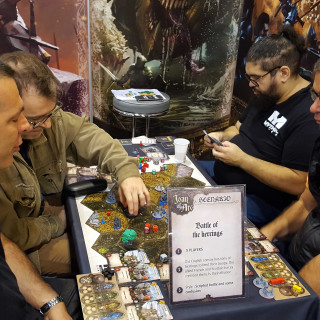 Folks Are Busy Having Fun At The Mythic Games Booth!