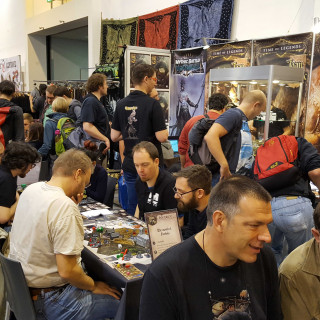 Folks Are Busy Having Fun At The Mythic Games Booth!