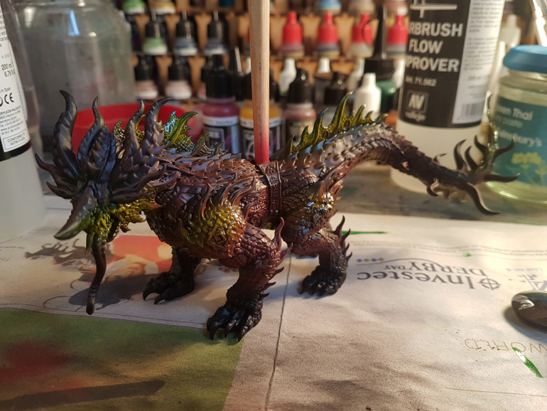 Adding Vallejo yellow to spines, face, belly, again with an airbrush