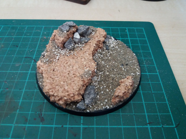 Step 1: I picked up a few bits of cork and arranged it so I could have him with one foot on a rock, I know this is the standard pose for a hero but with it being the first in the force I had to give it a go.  I then added some small rocks and sand.