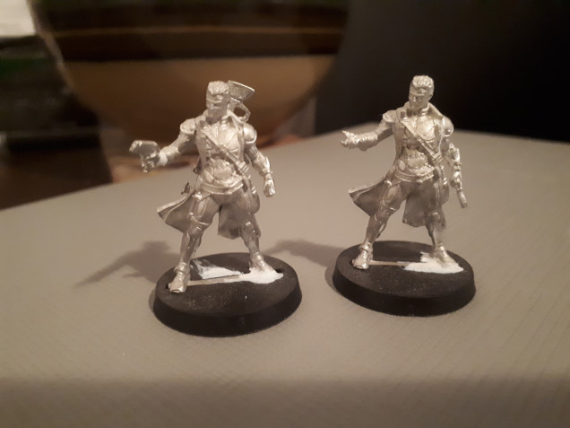 This is Tomax and Xamot. I did some minor hand swaps to make the same model look just slightly different. I used the Myrmidon doctor officer.