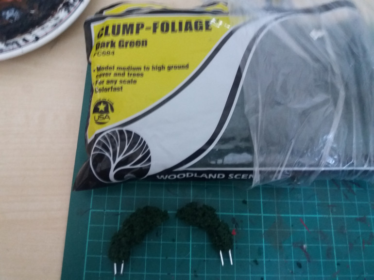 Step 2: Slowly build up the foliage until nearly the whole wire is covered, remember to leave a bit to go into the exhausts.