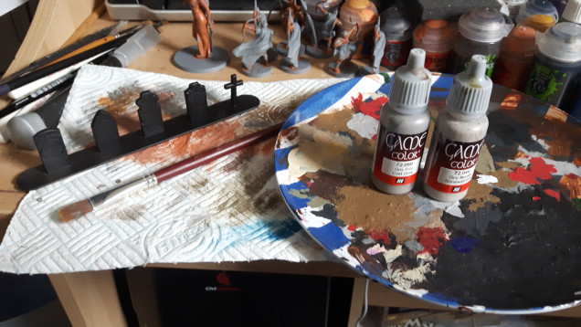 For this I'm using Vallejo cold grey and highlighting it with stonewall grey.  I'm drybrushing them over black, to keep them gloomy looking.  My brush of choice comes from a cheap brush set in got from The Works.  They make fantastic drybrushes for terrain. 