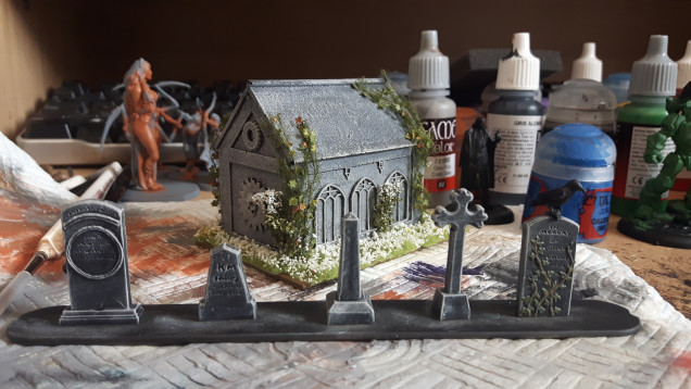 Here's a mausoleum my other half painted.  The mausoleum is from Templar Wargames.  I've tried to make the gravestones look as similar to the mausoleum as I can.