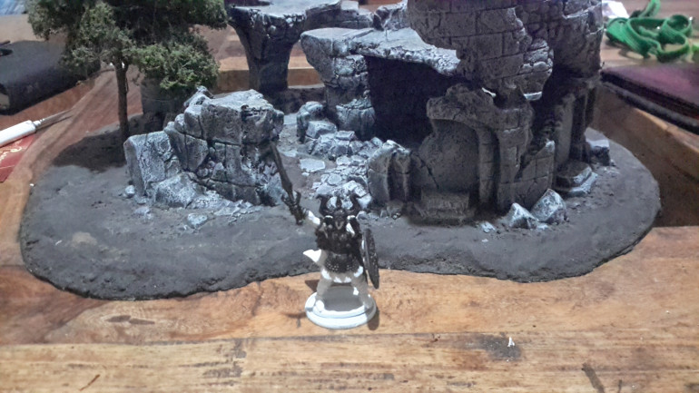 So far I have undercoated the miniature white and then picked out all metallic and dark areas in black, tonight I will start to put down base colours. Behind Vashel is the Reaper Bones scenery that came with a pair of fighting dragons, this was given me by a friend and has been in this partially painted state for a while, time to get it finished.