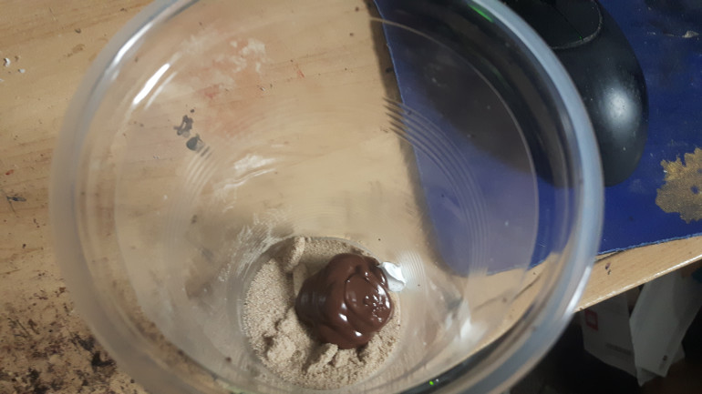 I've added a splat of paint to the tub. I then mixed it all together. The mixture was a tad dry so a stirred in another splat of paint to moisten it up.