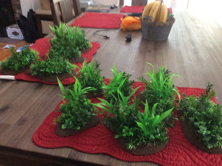 Full set of jungle scatter terrain bases partially complete