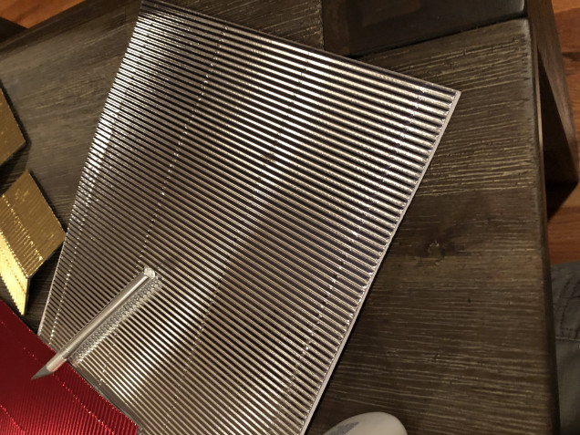 Sheets of corrugated metallic cardboard