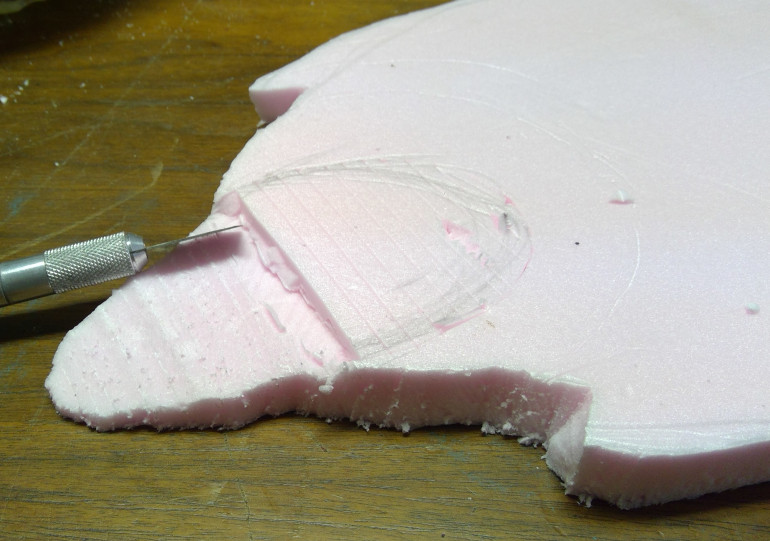 Shaped to fit inside of lower jaw and cut lines for beginning of cave interior.