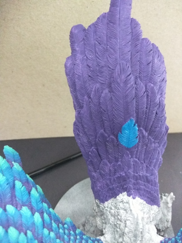 Normally I work on a row of feathers, but for this walkthrough, I'll show on a single. I cover approximately two thirds of the feather in the Mediterranean Blue. I try to follow the lines in the feather, so the flow looks more natural.