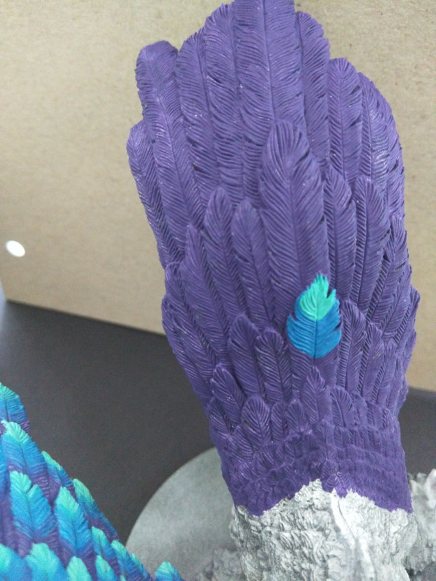 Then I add a few layers of the Carribean Blue in approximately the last third of the feather.