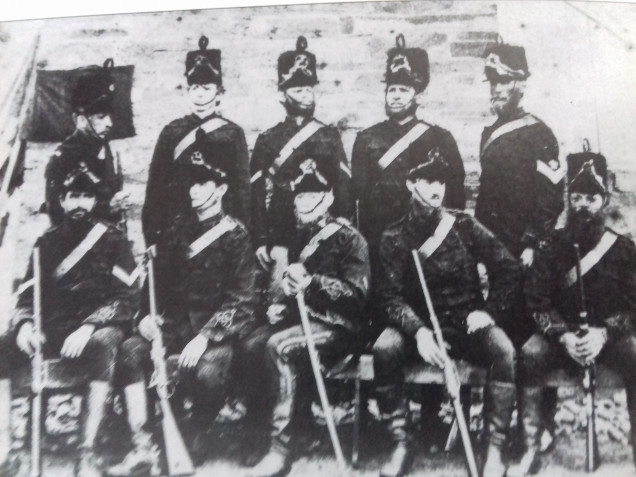 Unusual picture of the Hussars with busbie hats painted on to the picture which they never wore