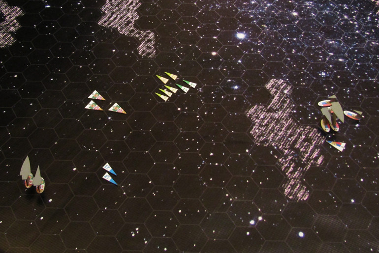 The fleets continue to close, the French (left) trying to keep the range long where their superior targeting electronics will give them an edge ... the Russians (right) trying to use ionized density waves as a kind of 