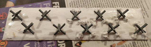 The tank traps with the pre-smoothed blobs of filler around each post