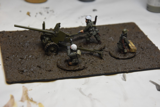 Notice the gun is fixed to the base while the crew can be removed. The ammo box just adds some detail. Can the wet mud be now frosted? Thinking adding some bushes for the ambush but with no leaves