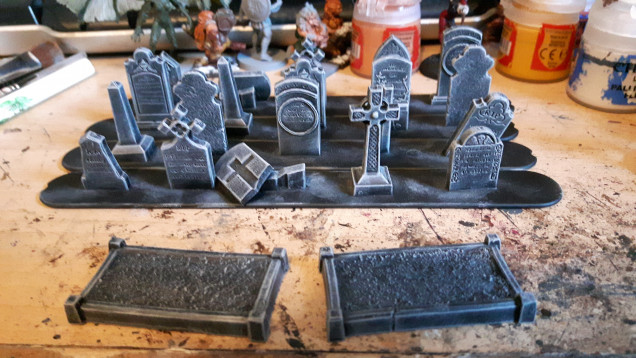 I've finished painting the last of the gravestones. Just need to paint the creepers on one of them.