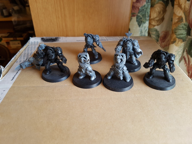 Terminators(?) already on bases.  Some have braids and claws.  I assume this means I bought a Space Wolves army?