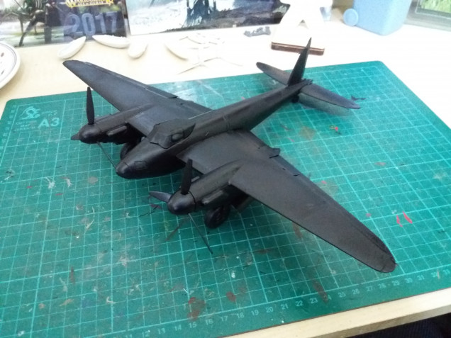 So all the glue had dried so I've given the whole aircraft a base coat.  I went with black rather than white but I think I may regret that as the lighter colours will require more coats.  