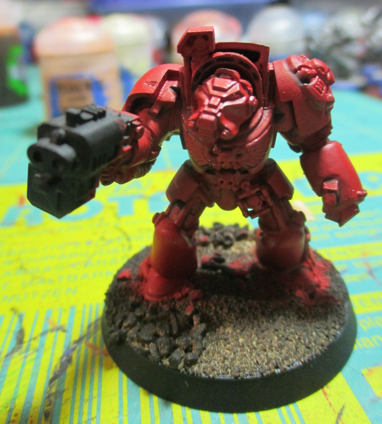 The touch up of Mephiston Red just helps with the definition of the miniature.