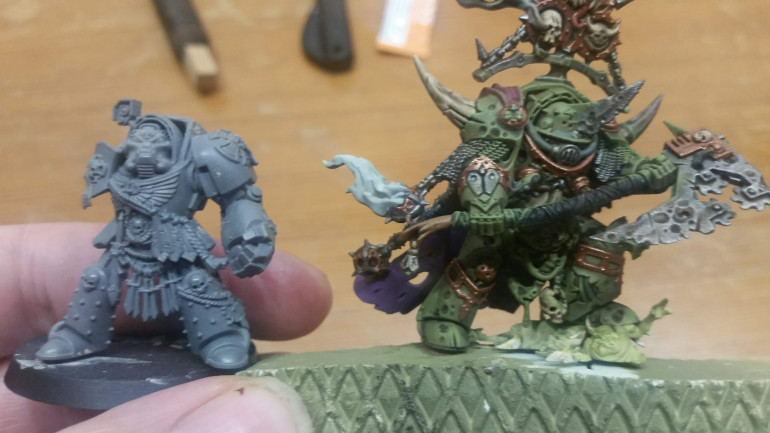 The Lord of Contagion is wearing Cataphracti Armor, which is supposed to be more bulky.  But unless it has really high plateau soles, why should it make him taller?