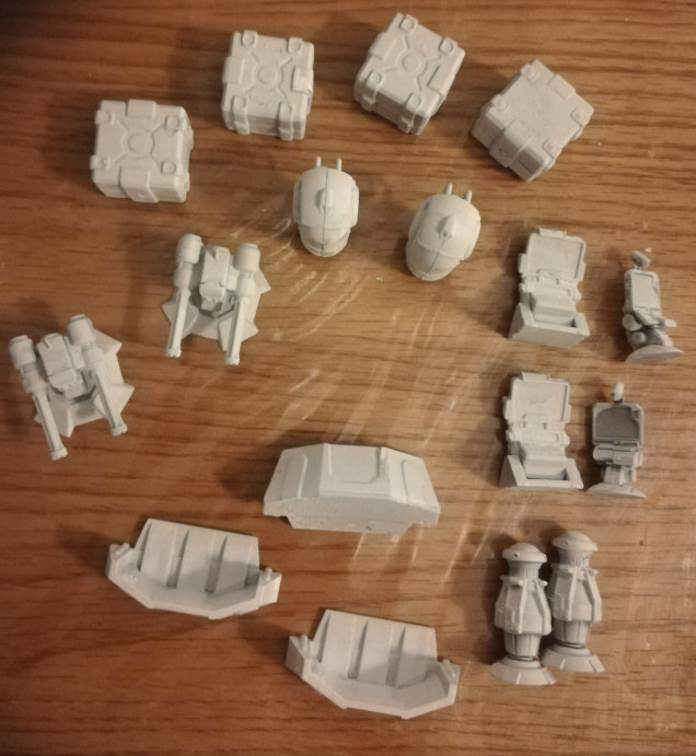 The box also includes some scatter terrain which I have also primed white. 