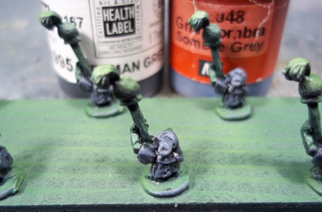 Goblin Clothing - Highlight by adding Vallejo Game Color Sombre Grey to the German Grey