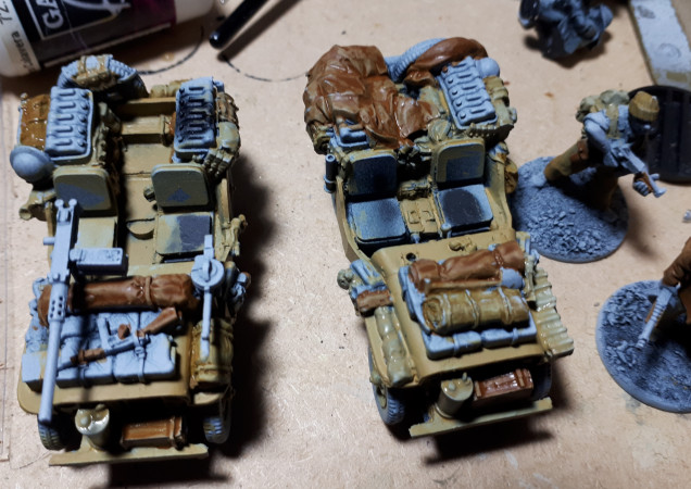 Started adding thin coats of colour to pick out storage. The thin layers allow the pershading to show through. I am not too concerned about being really neat at this stage, I will add a wash and weathering later that will cover up any issues.