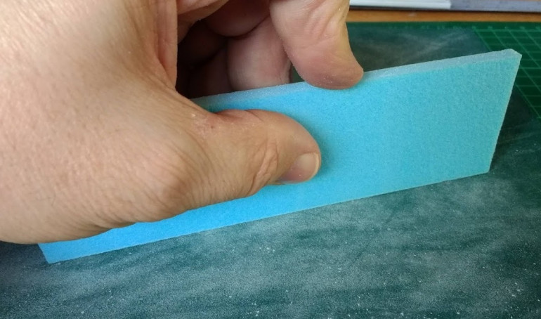 After cutting some of the edges aren’t quite square, so a quick pass over a sheet of sand paper flat on the desk top will soon straighten it out. To find out if the edge is straight, stand the piece on edge and see if it falls over or leans over out of true. 