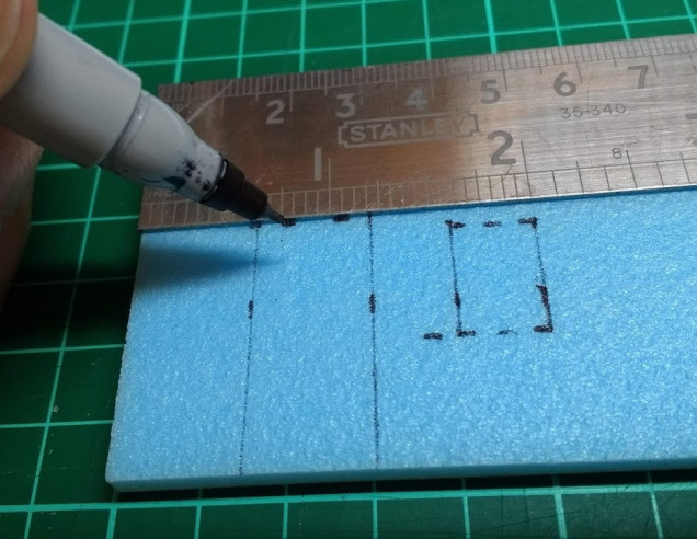 Next I sketch in the lines for doors and windows, a ruler and a set square help to keep everything in line