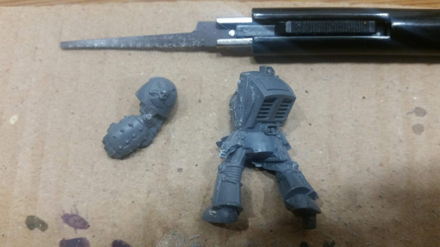 I remove any molded on arms from the model with the modeling saw.