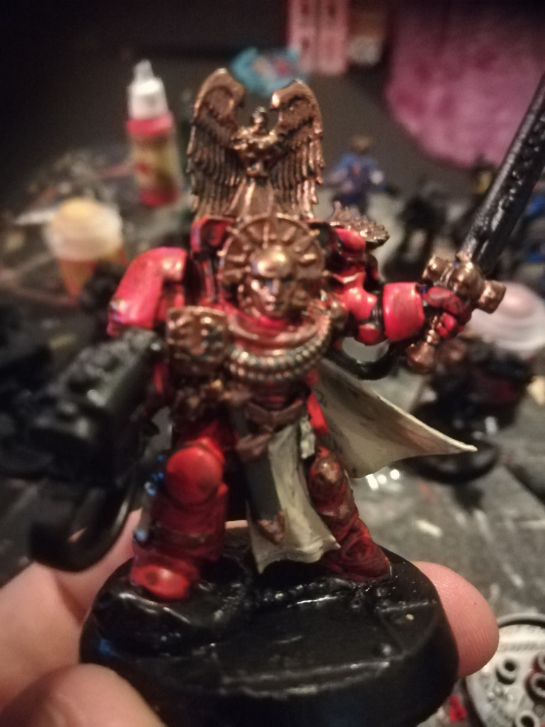 WIP of my captain the models came with no helmets but the fluff of the space hulk rules say that the space hulk as no atmosphere so I swapped out the heads and added some extras from my bits box. 