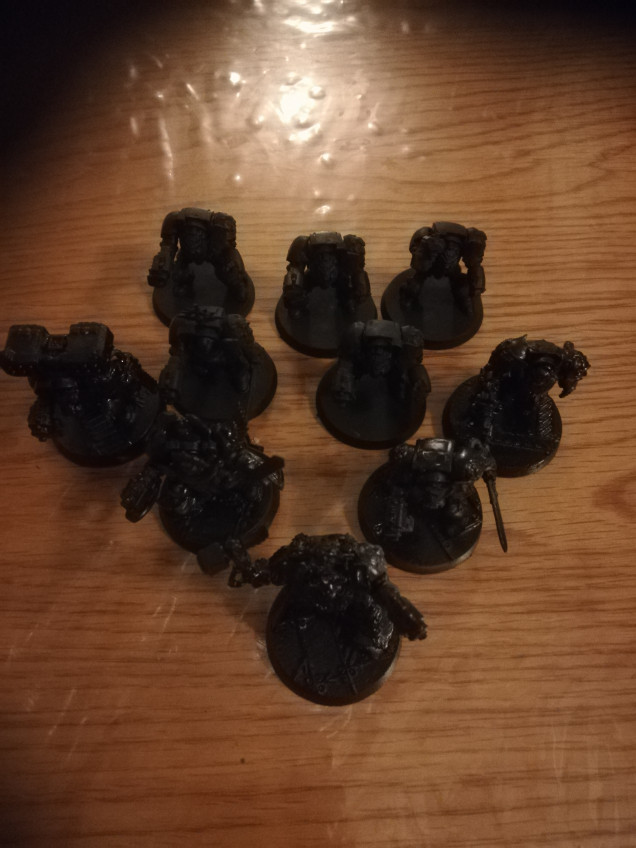 My terminators arrived from ebay, I got a bargain as each terminator cost me 50p. I have under coated them black and started painting them up as the blood angels. There will be 2 squads of 5. 1 captain in each with a second in command, a flamer and two other with bolters.