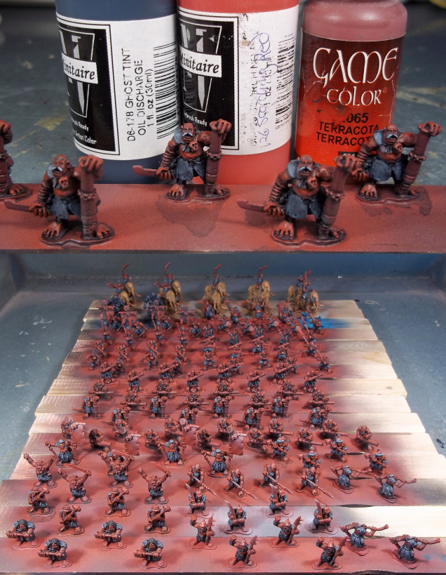 Clothing was then washed with Ghost Tint Oil Discharge mixed heavily with Flo-Aid and airbrush thinner.  I then picked out the highlights on the skin by mixing a bit of Minitaire Scorching Red into Vallejo Game Color Terracotta.