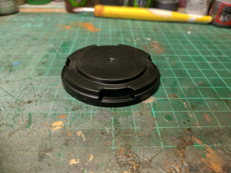 Removing one of the caps i cut off the extras to leave me with just a single circular section of plastic.