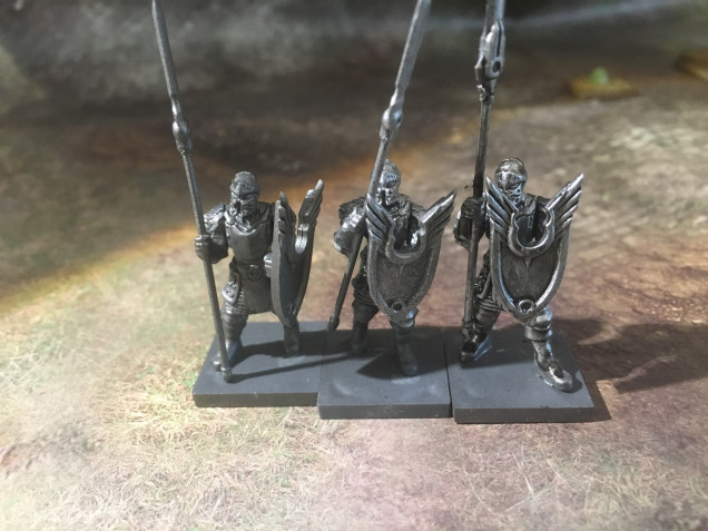 From left to right 1) Metal spray  2) Silver Dry-brush 3) Nuln Oil Gloss wash ( This wash doesn't darken the armour too much, flows nicely into the recesses, gets rid of most of the dry-brush's graininess and gives the armour a nice shine ..... I love the stuff