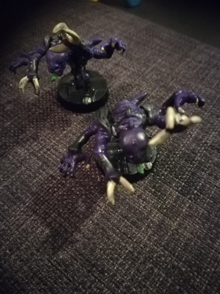 For reference I have undercoated the miniatures black. For the flesh I have used vallejo game colour heavy violet and the teeth, claws and spikes are  ushabti bone, I particularly like the Warboss green tongues