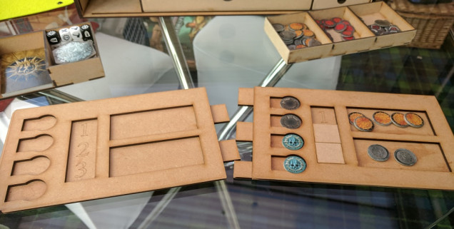 Finally the front section of the box separates into two play trays with 4 compartments for action trackers, a slide counter to track what round its on (just encase you've had a couple of drinks) and two compartments for glory tokens and spent glory.