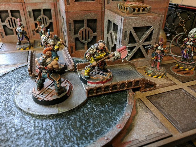 I like scenery which limits movement or provides obstacles to traverse, looks like these Goliath gangers have fallen into an Escher ambush.... Time to sink or swim.