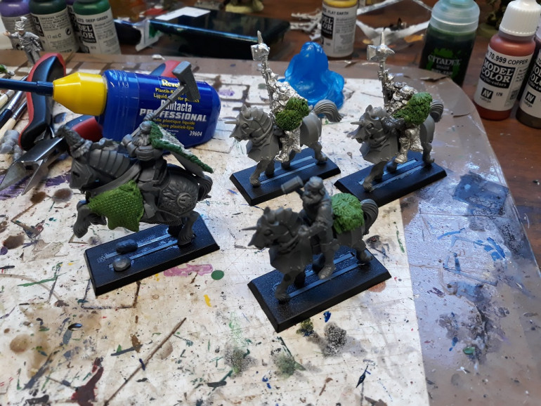 The crew from today. Grandmaster still needs more work but happy with the extra bulk on the horse. Thinking of adding fur blankets on the rea to make it look halfway to chaos (hey - it's a big hammer wielding hairy guy from the north...)