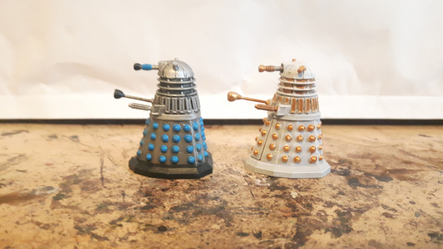 Dalek warrior (pre Davros 1963) and Imperial Dalek (post Davros 1975).  I had to rebuild the plungers on these, f***ing cats.