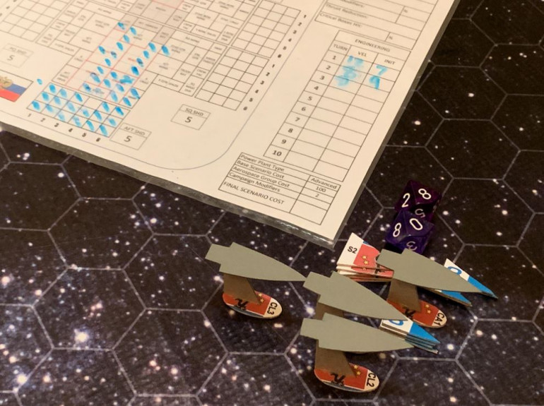 The results of my ordinance strike.  Most of my warships torpedoes were shot down, either by Black Dragon scouts or mass driver defensive fire from those cruisers.  Yes, USS Tarawa and specially Oriskany have Electronic Warfare battle upgrades that made this  more difficult, but these are BIG enemy ships that just have walls of guns along their beams.  However, this allowed by Marine aerospace ordinance to get through (hence, you always want to combine your ordinance strikes into single, massive waves).  The damage on the Tzarakin was pretty severe, despite her heavy shielding and armor, and then I get pretty lucky on the hit locations.  The damage chart shows were I hit no less than 15 critical structure boxes, meaning that not only is the Tzarakin crippled (no roll required), but there is a 20% chance she blows up right here, wiping out those scouts and burning off large slabs of armor off other Black Dragons ships.  Jenn rolls a 36, however, indicating that the Tzarakin managed to eject her reactors before they went critical.  The ship is just crippled, but didn't explode.  One thing that really helped this ordinance strike is the fact that these Marine Pilots have been double-upgraded with 