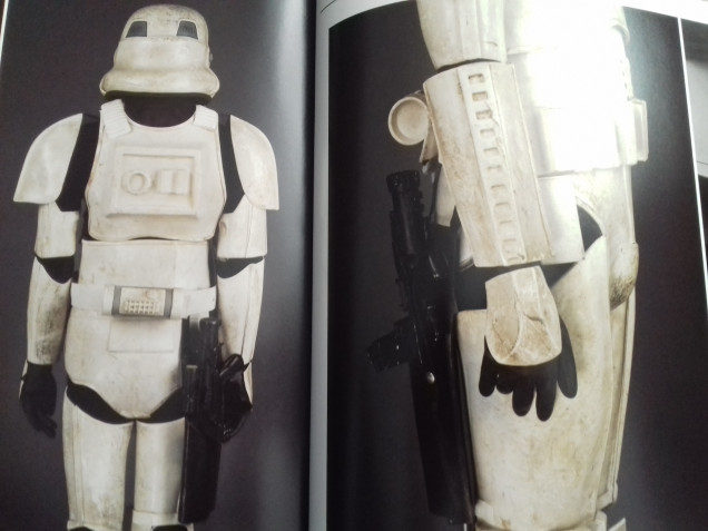 Holstered blaster on worn armour