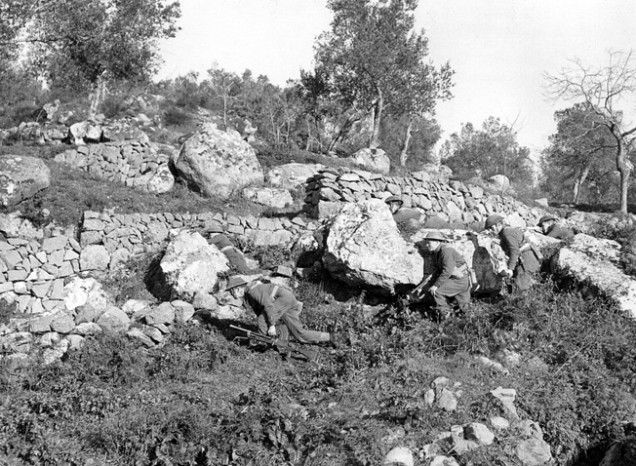 Allied troops advancing up the hill