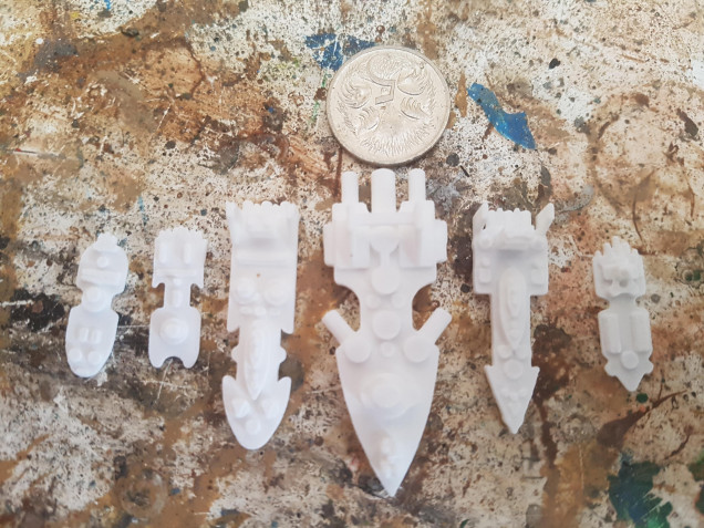 The Ships are about 20mm wide and 50mm Long (Just less than an inch and about two inches) 