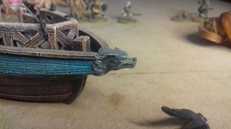 The wolfshead (Fenris Games) added to the model. Harreks pirate ships had live wolfs head on the prow of their ships.