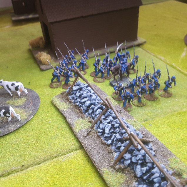 Captain Lewis Leads his Men Along the Stone Wall While Sergeant O'Reilly Leads the Skirmishers into the Trees