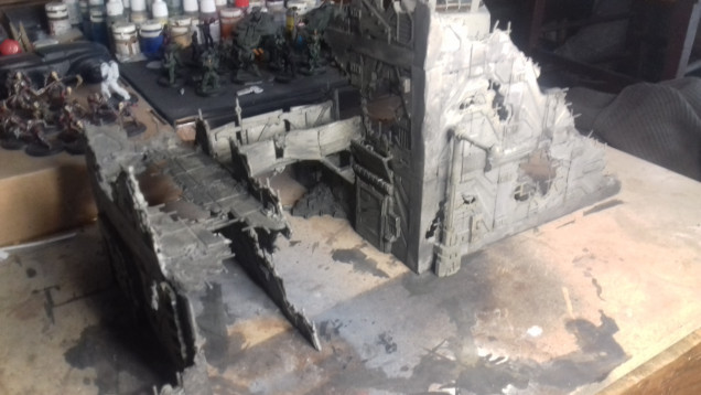 I have now undercoated the building white ( I have run out of Black) and given it a wash mixed from black and pale khaki.