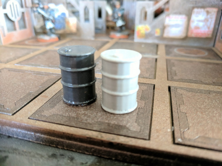 I put together a simple oil drum shape in Blender and printed it off on my 3D printer, once i was happy with the size i made a rubber mould so i could run off as many copies as i like.