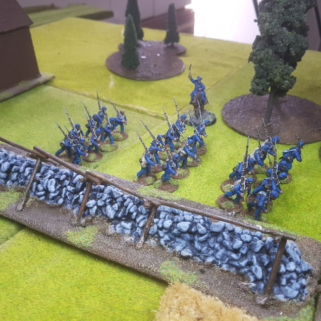 Captain Lewis' Men Advance Down the Stone Wall Hoping to Attack Across the Cabin's Lawn and use their Superior Numbers to Take the Confederate Deployment Point